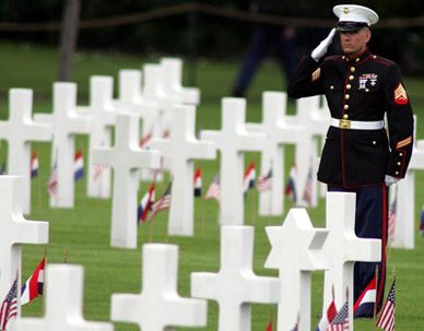 Giving Honor Marine saluting graves